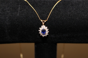  14kt Yellow Gold Necklace with Sapphire Pendant.